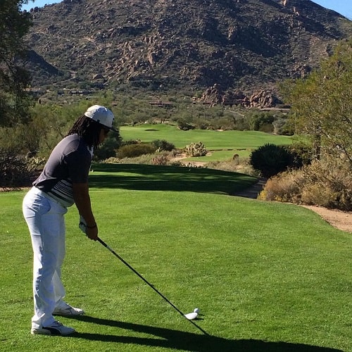 A picture of Duncan Spencer playing golf.
